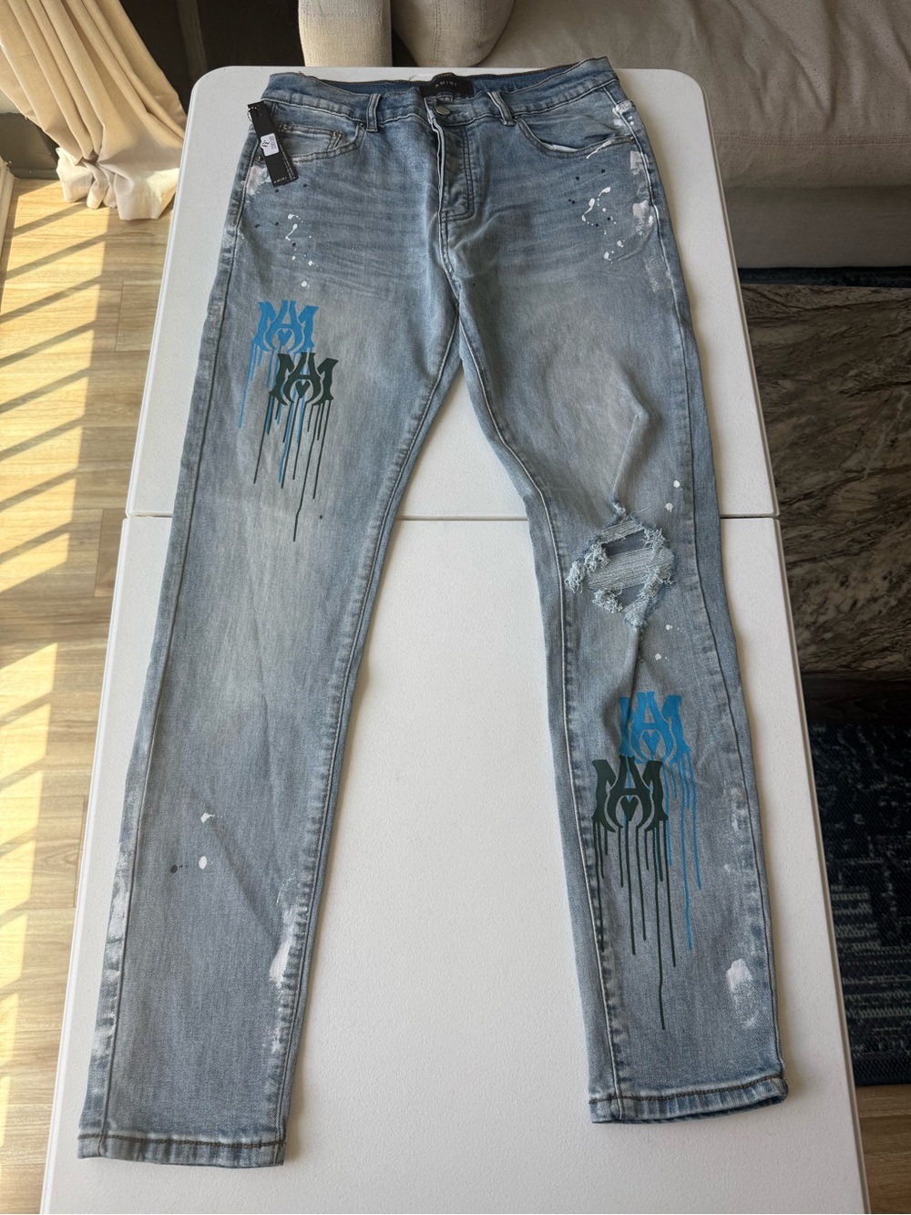 AMIRI Light Gray Skinny Jeans with Blue & Black Drip Graphics